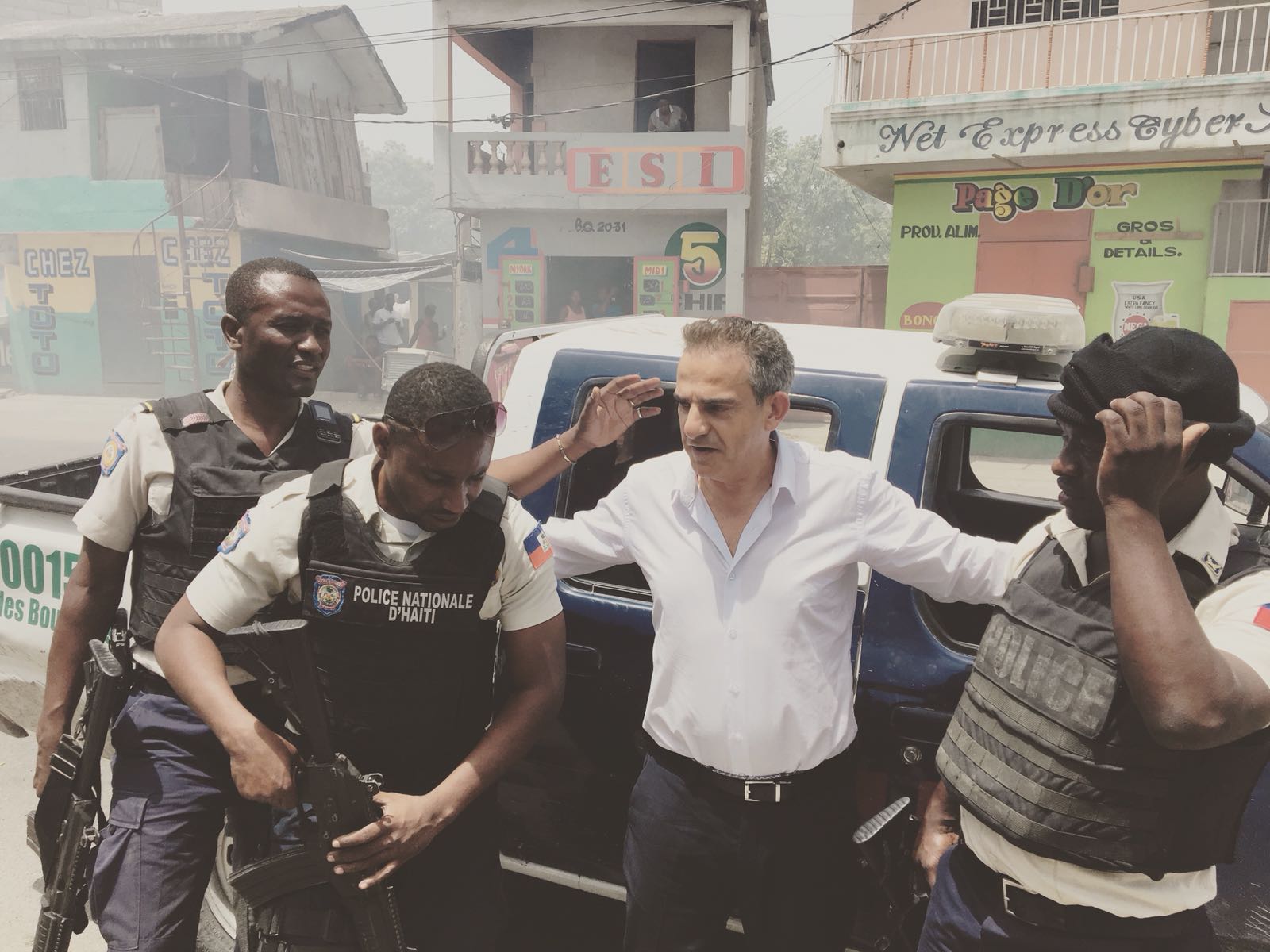 Fernand with his police escort at a roadblock outside Port-au-Prince, July 08, 2018