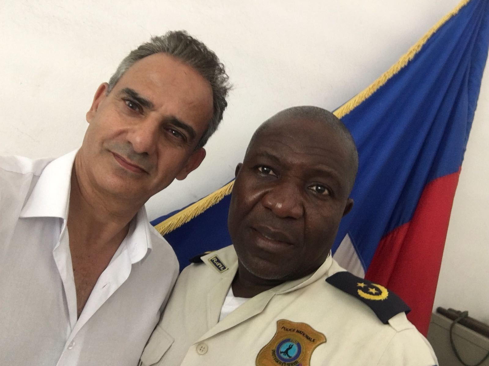 Fernand with District Commissioner Pierre Ronda outside Port-au-Prince, July 07, 2018